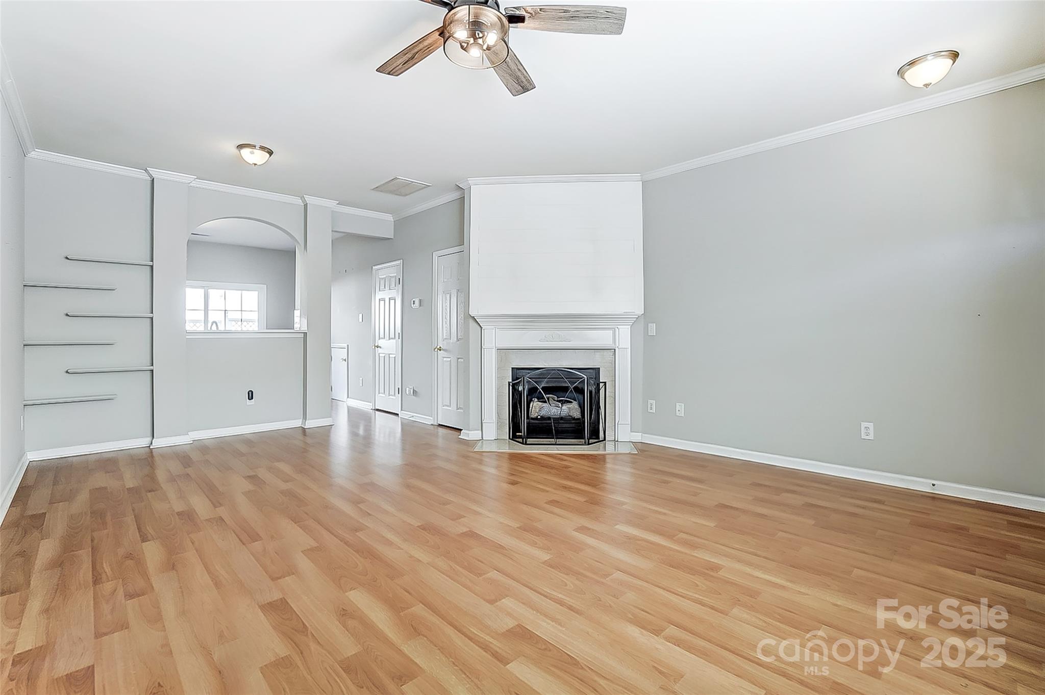 928 Azurine Circle Fort Mill, SC 29708 - Photo 7 of 33 a view of empty room with wooden floor and fireplace