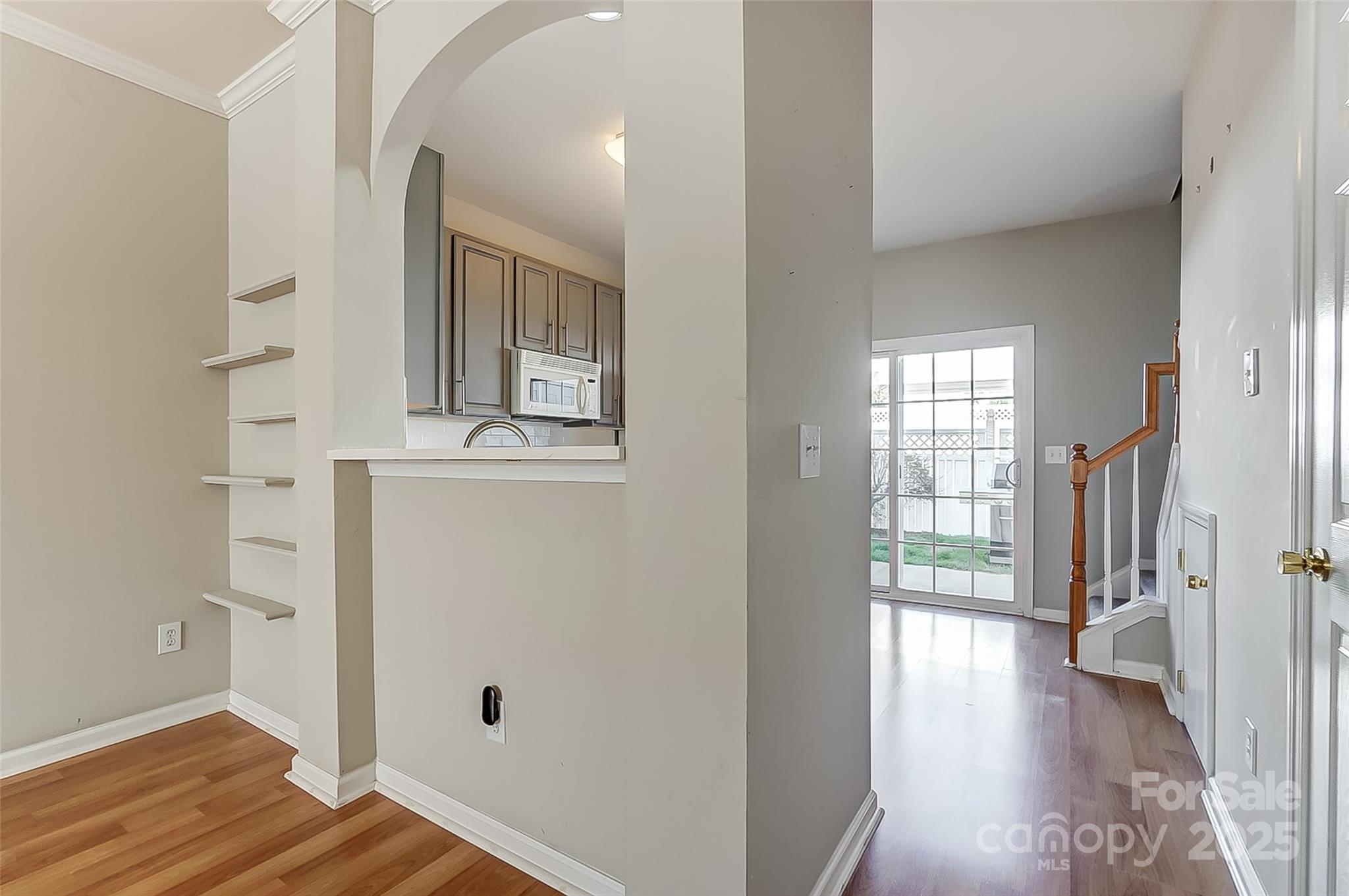 928 Azurine Circle Fort Mill, SC 29708 - Photo 10 of 33 a view of a hallway with wooden floor and a living room