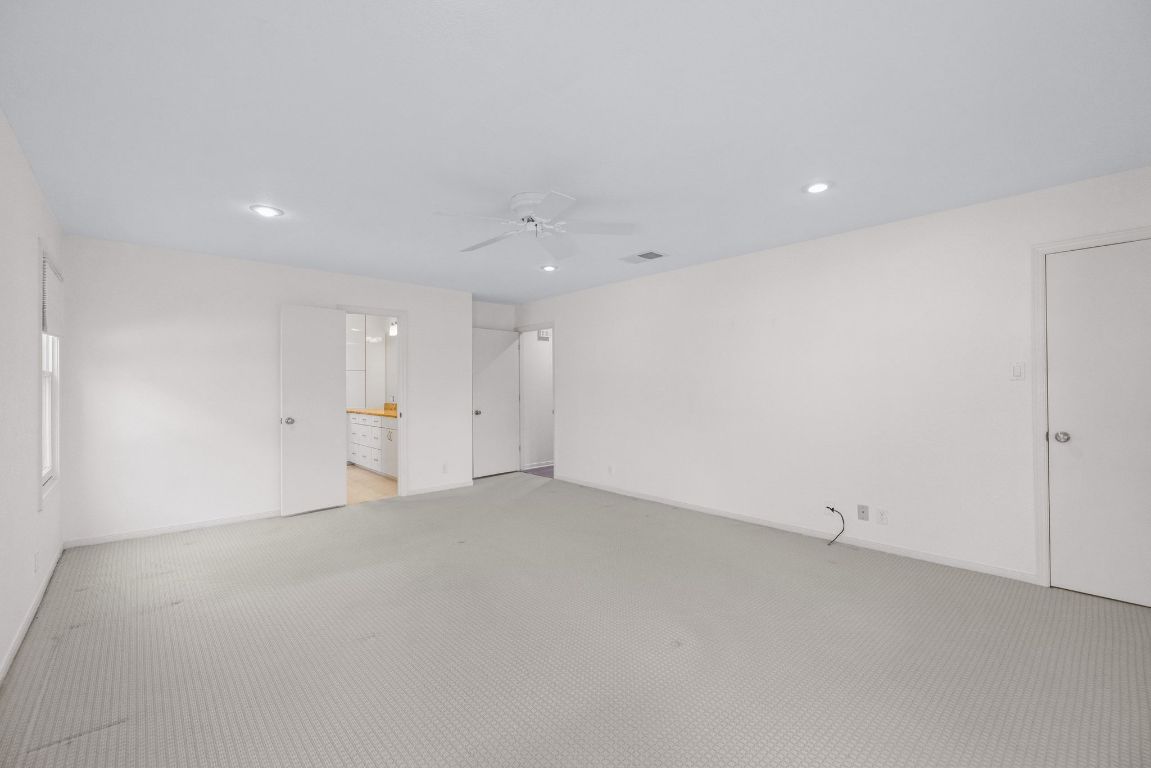 1508 Ben Crenshaw Way Austin, TX 78746 - Photo 16 of 40 an empty room with window and pillar in it