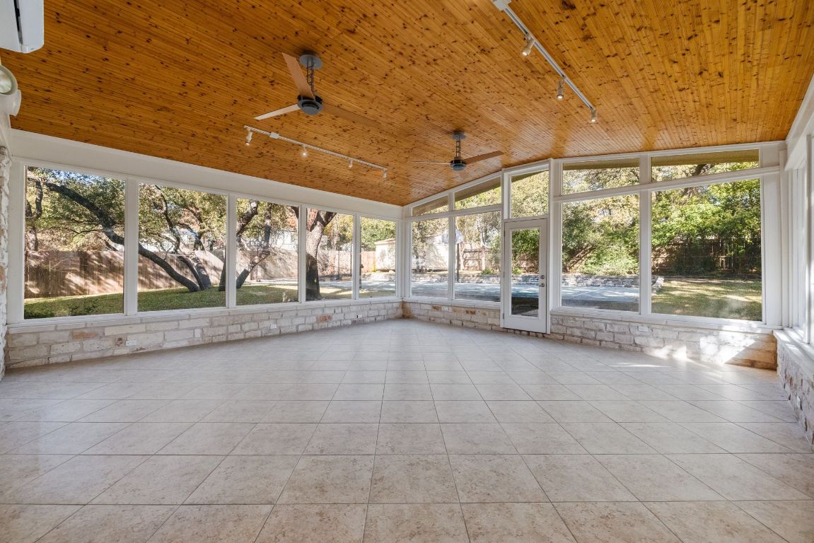 1508 Ben Crenshaw Way Austin, TX 78746 - Photo 25 of 40 a view of an empty room with a window