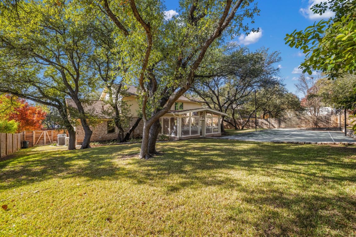 1508 Ben Crenshaw Way Austin, TX 78746 - Photo 27 of 40 a view of a yard with a tree
