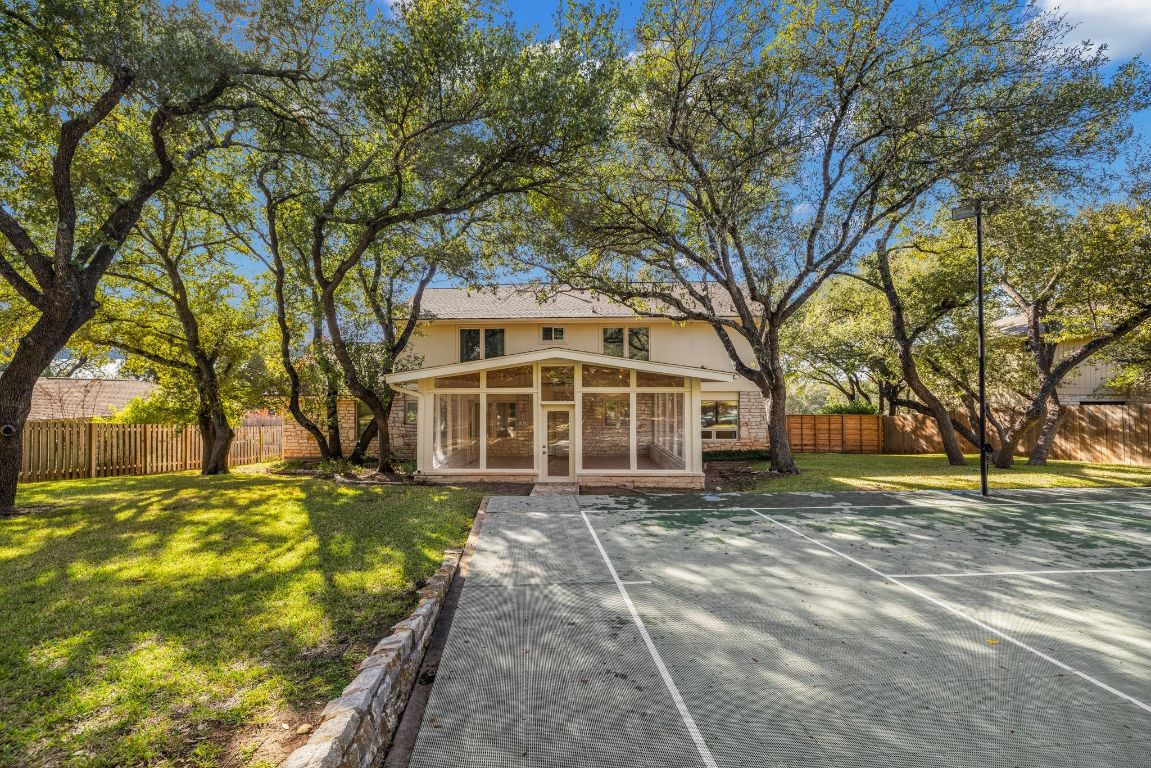 1508 Ben Crenshaw Way Austin, TX 78746 - Photo 29 of 40 a view of a yard with a large tree