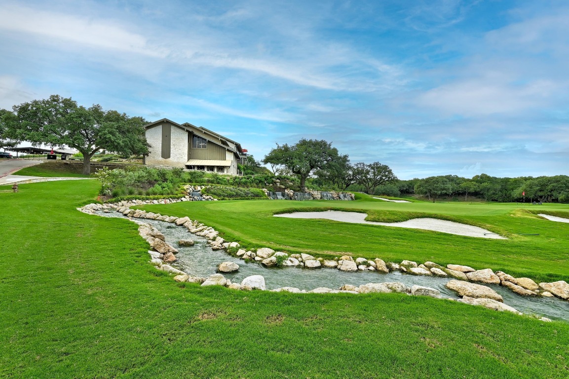 1508 Ben Crenshaw Way Austin, TX 78746 - Photo 30 of 40 a view of a golf course with a garden