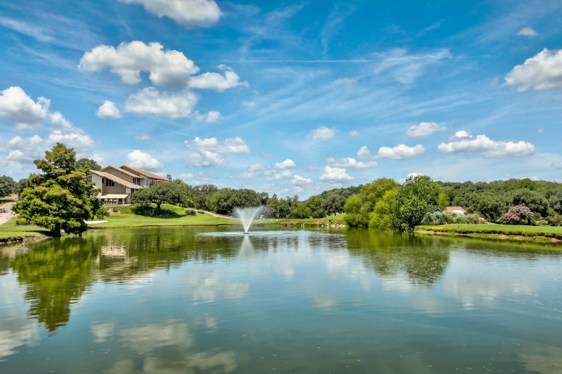 1508 Ben Crenshaw Way Austin, TX 78746 - Photo 38 of 40 a view of a lake with a yard