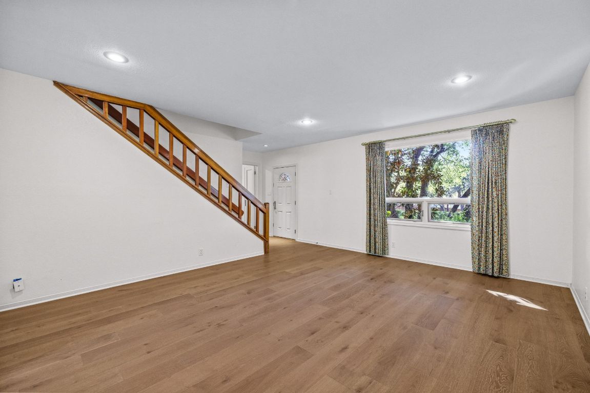 1508 Ben Crenshaw Way Austin, TX 78746 - Photo 5 of 40 a view of an entryway with wooden floor