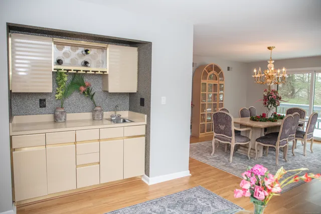 a dining room with furniture and window