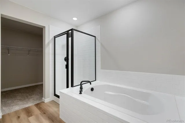 a bathroom with a tub and a sink