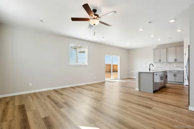 a view of kitchen with wooden floor and window