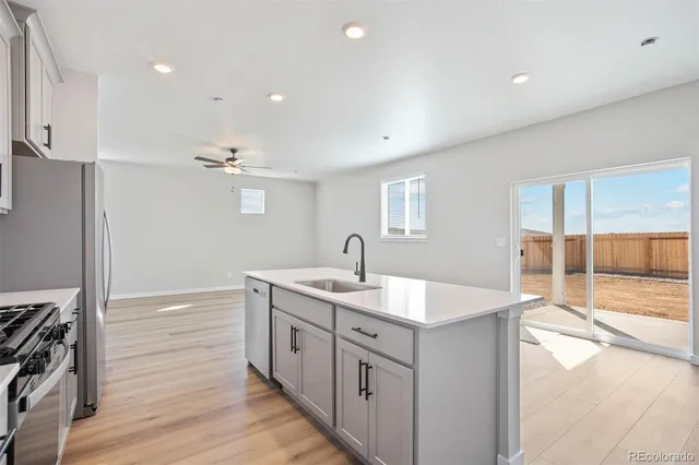 a spacious bathroom with a granite countertop sink a mirror and a