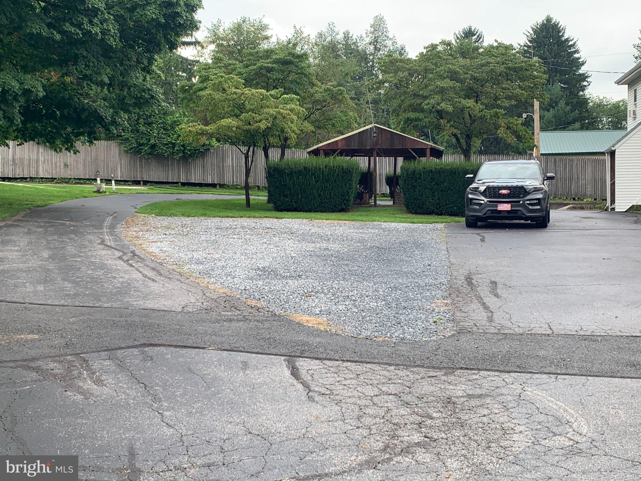 315 York Road Carlisle, PA 17013 - Photo 8 of 27 Charming driveway with lush greenery.