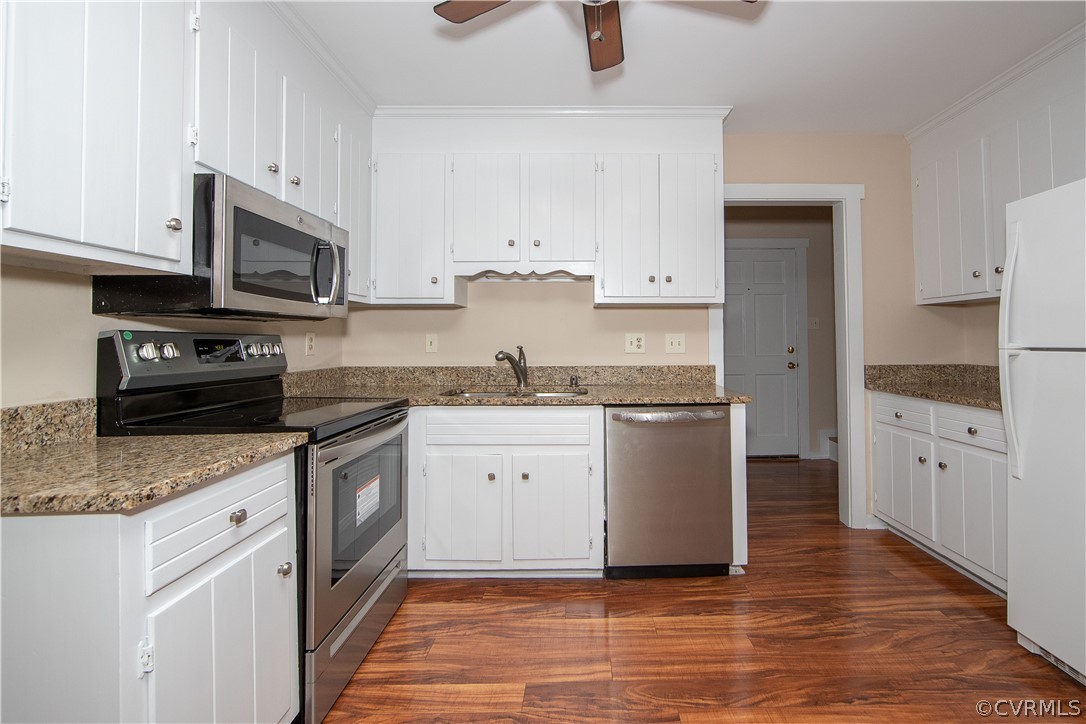 4702 Wilconna Road Chesterfield, VA 23832 - Photo 14 of 27 a kitchen with stainless steel appliances granite countertop a stove a sink and a microwave