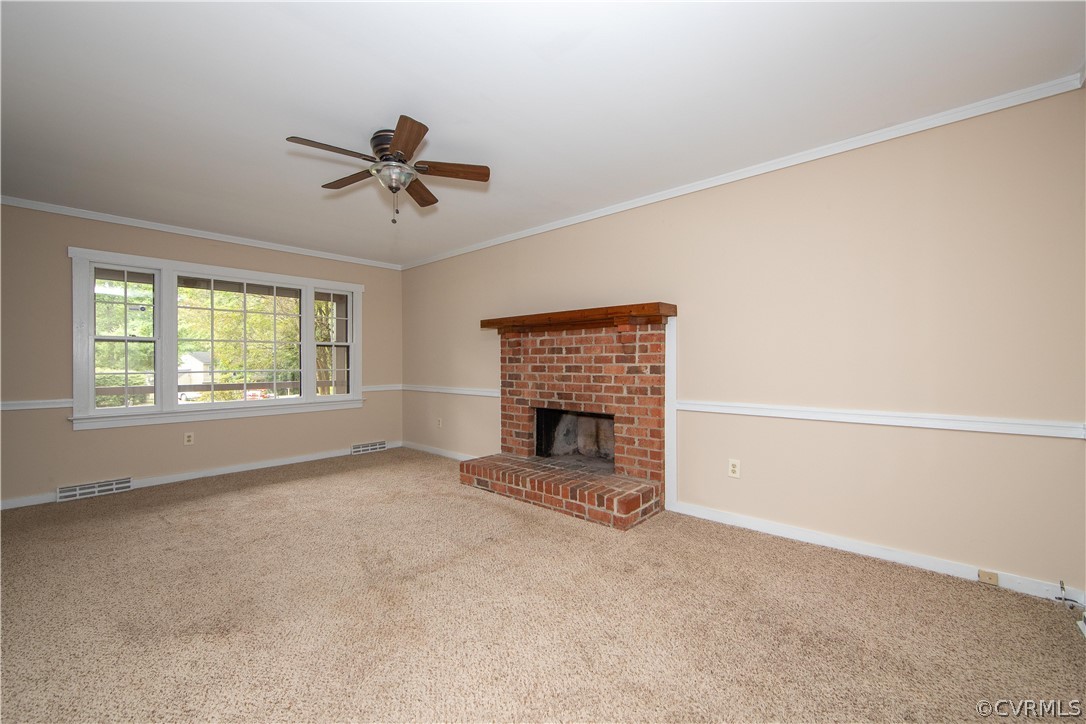 4702 Wilconna Road Chesterfield, VA 23832 - Photo 15 of 27 a view of an empty room with a fireplace and a window