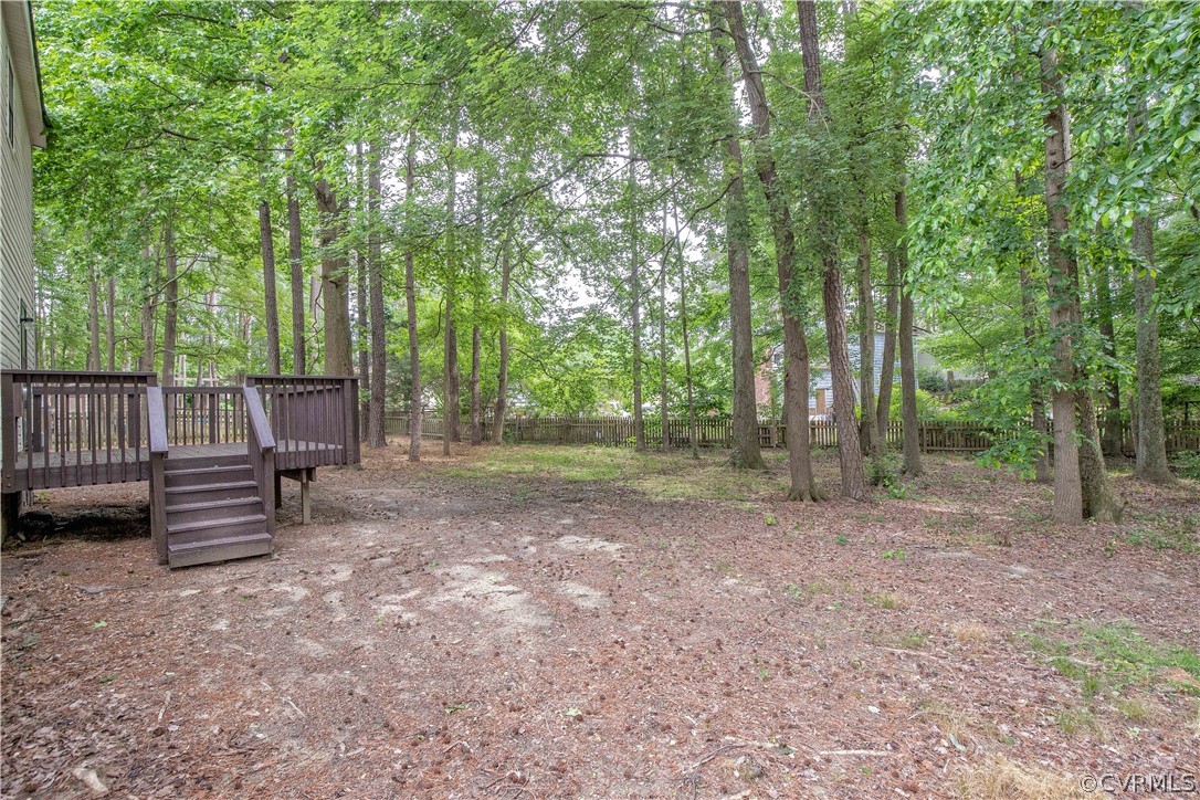 4702 Wilconna Road Chesterfield, VA 23832 - Photo 6 of 27 a view of a backyard with trees