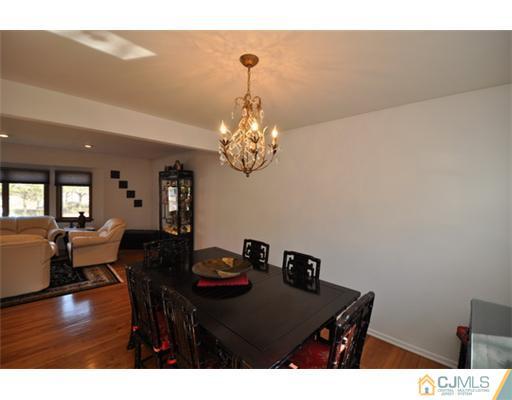 38 Dumas Road Old Bridge, NJ 08857 - Photo 3 of 18 a view of a dining room with furniture and wooden floor