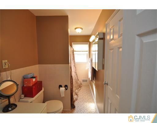 38 Dumas Road Old Bridge, NJ 08857 - Photo 8 of 18 a bathroom with a sink and a mirror