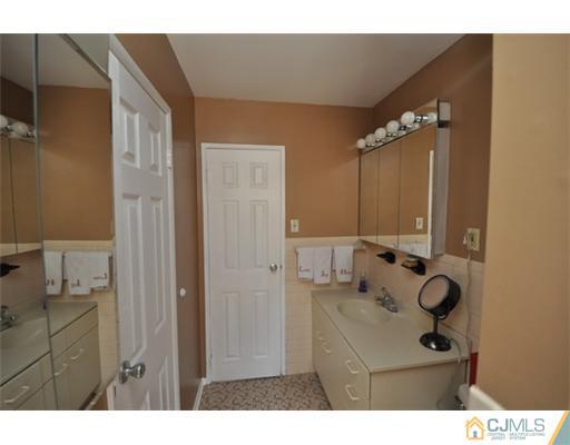 38 Dumas Road Old Bridge, NJ 08857 - Photo 10 of 18 a bathroom with a sink vanity and mirror
