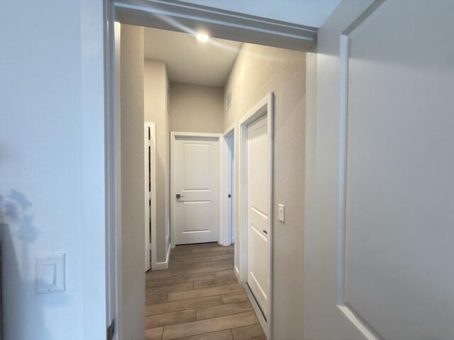 19696 Weathervane Way Loxahatchee, FL 33470 - Photo 20 of 39 a view of a bathroom from the hallway