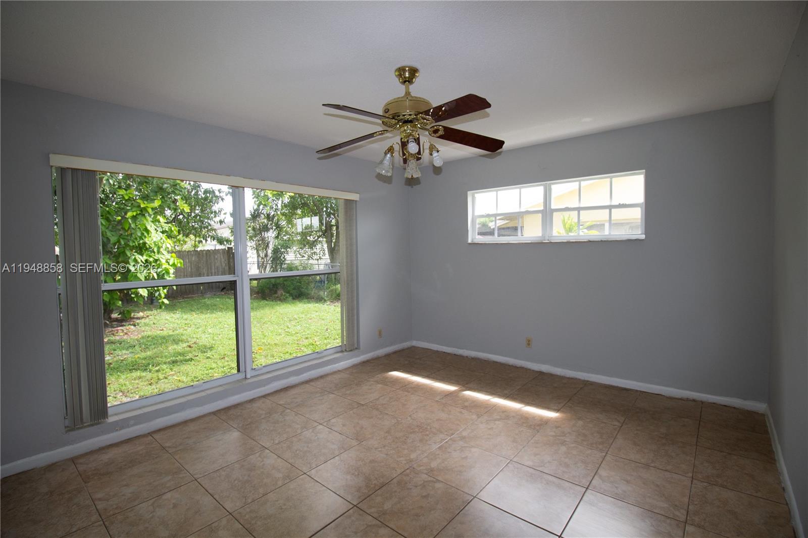 420 Southwest 62nd Avenue Margate, FL 33068 - Photo 14 of 22 a view of room with window and ceiling fan