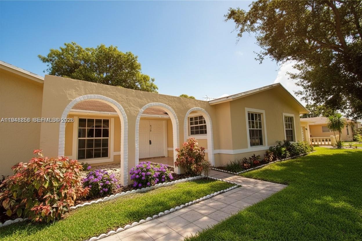 420 Southwest 62nd Avenue Margate, FL 33068 - Photo 2 of 22 a front view of a house with garden