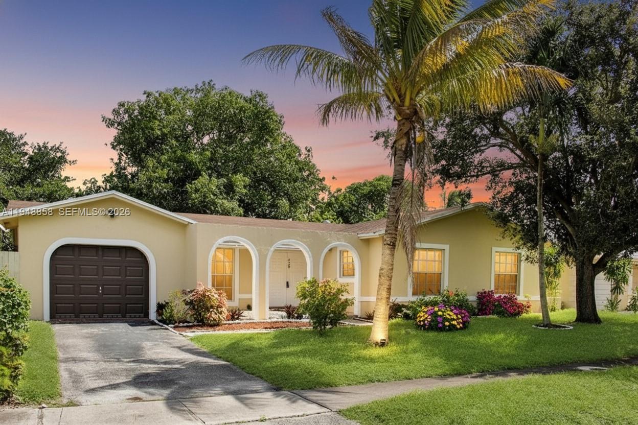 420 Southwest 62nd Avenue Margate, FL 33068 - Photo 22 of 22 a front view of a house with a garden and trees