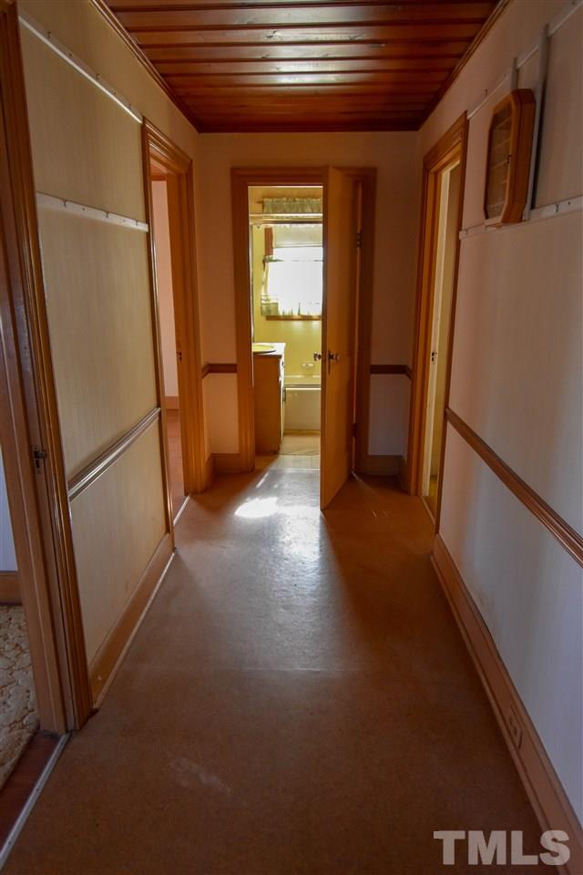 8919 North Roxboro Road Bahama, NC 27503 - Photo 14 of 26 a view of hallway with stairs and wooden floor