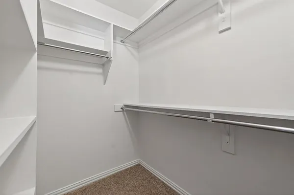 a view of an empty walk in closet