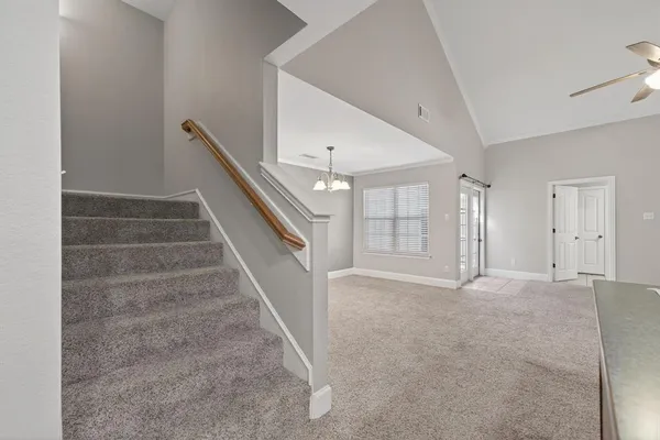 a view of an empty room with stairs
