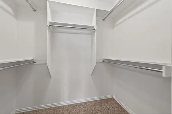 a view of an empty walk in closet