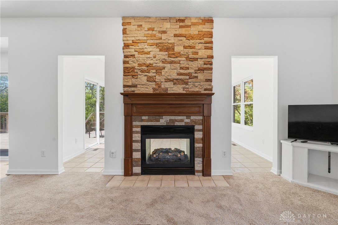 70 Martin Lane Springboro, OH 45066 - Photo 20 of 69 This inviting living area features a warm fireplace, perfect for cozy gatherings and tranquil evenings.
