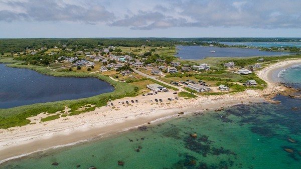 297 Howland Road Westport, MA 02790 - Photo 3 of 11 a view of a lake with a beach