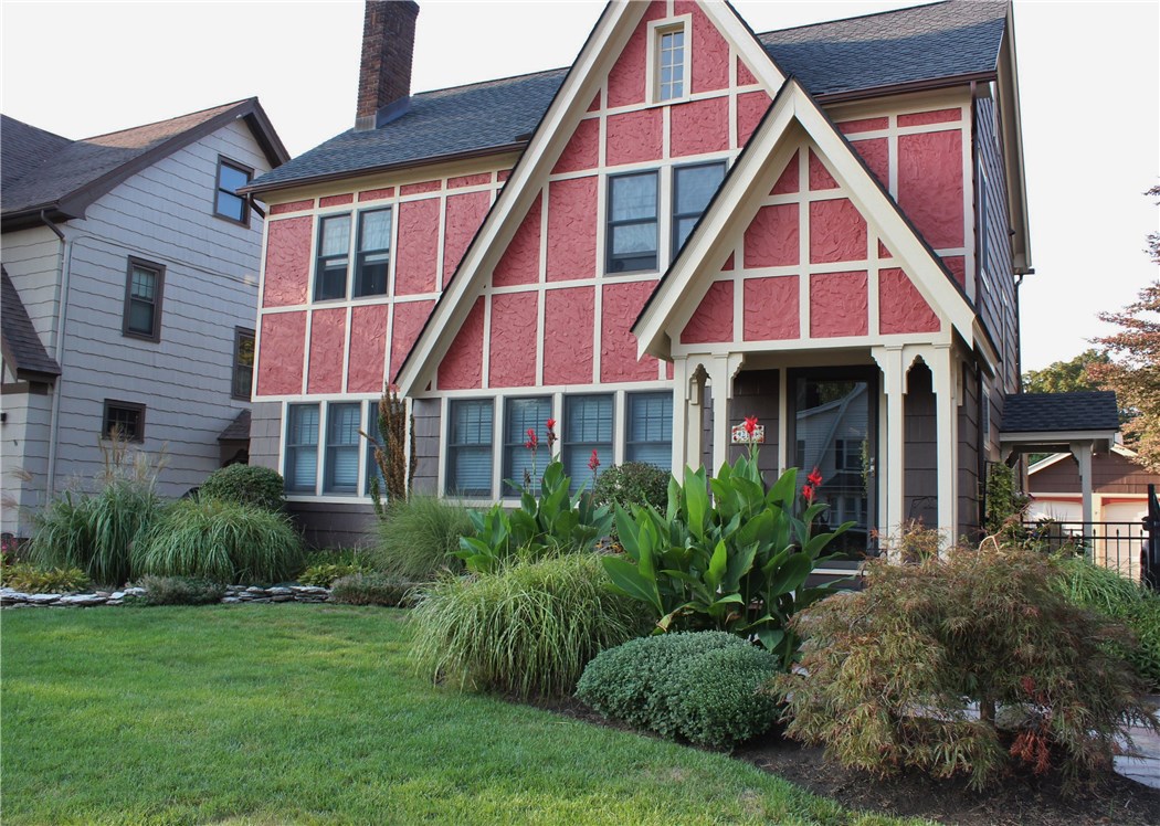 Stunning landscaping adorns the front of the home.
