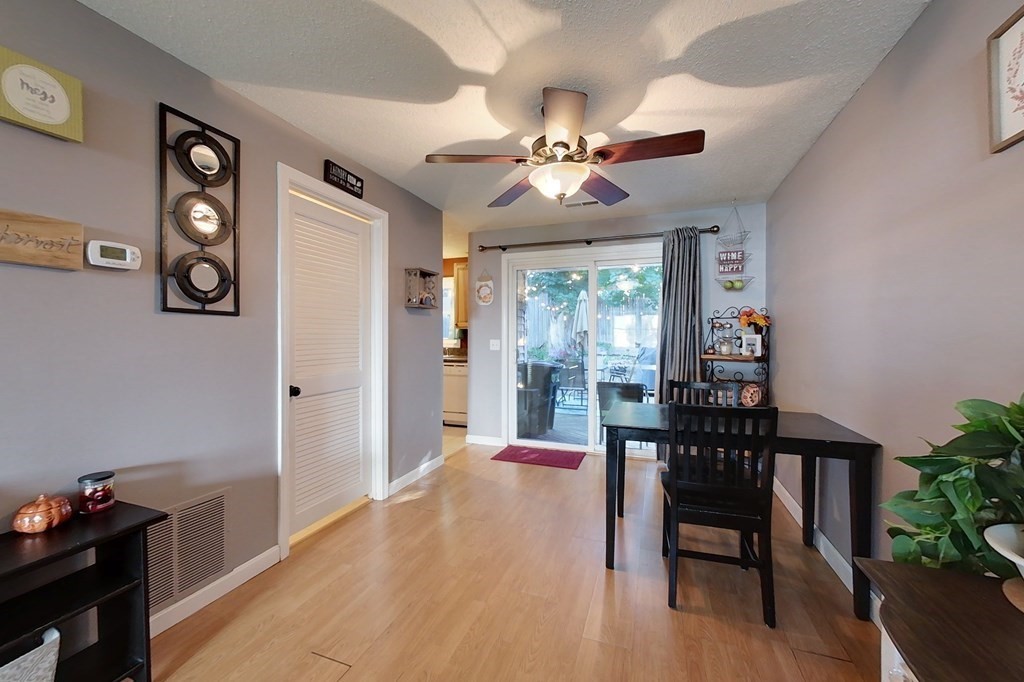 103 Main Street, Unit 16 Pepperell, MA 01463 - Photo 11 of 33 a view of a dining room with furniture and chandelier