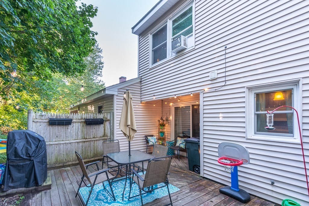 103 Main Street, Unit 16 Pepperell, MA 01463 - Photo 2 of 33 a view of a chairs and table in patio