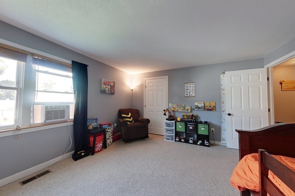103 Main Street, Unit 16 Pepperell, MA 01463 - Photo 24 of 33 a living room with furniture