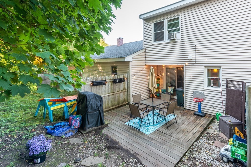103 Main Street, Unit 16 Pepperell, MA 01463 - Photo 29 of 33 a house view with a sitting space fire pit and outdoor space