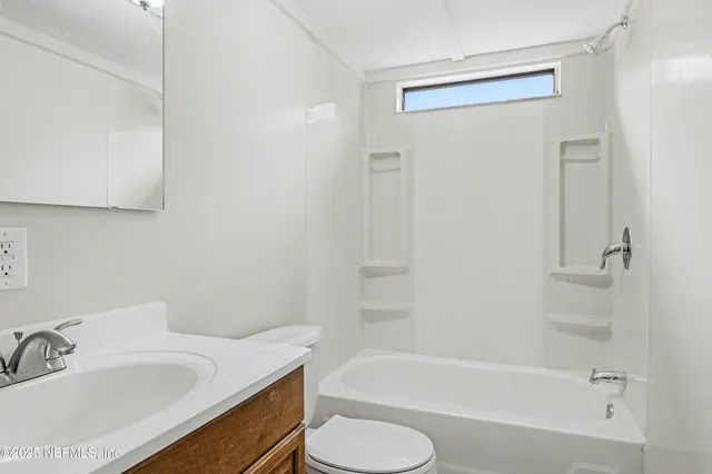a bathroom with a sink toilet and bathtub