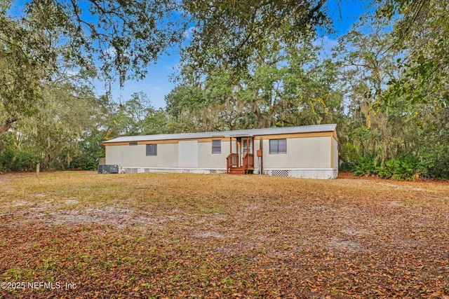 a house with trees in front of it