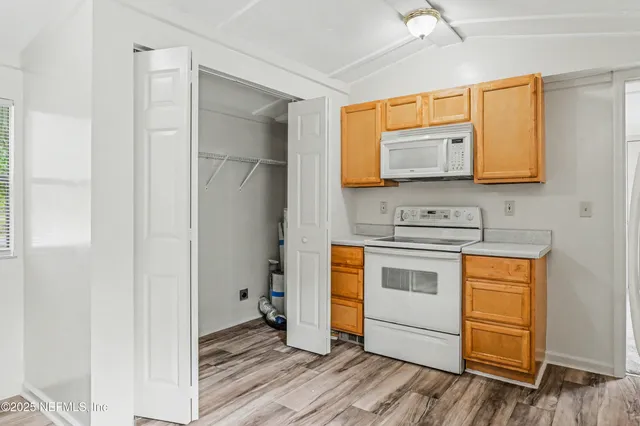 a kitchen with stainless steel appliances a stove and a refrigerator