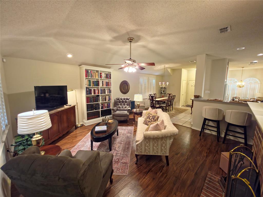514 Pinto Lane Forney, TX 75126 - Photo 16 of 28 a living room with furniture and a flat screen tv