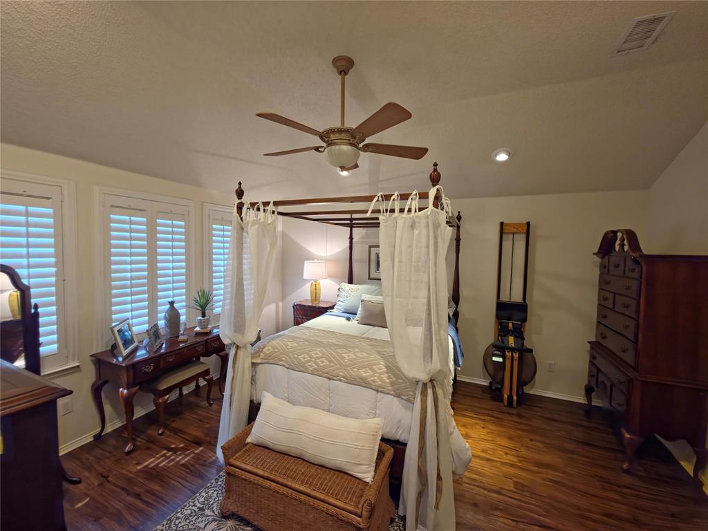 514 Pinto Lane Forney, TX 75126 - Photo 19 of 28 a bedroom with bed and wooden floor