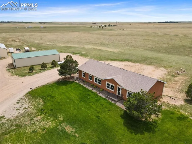 a view of an ocean with a building in the background