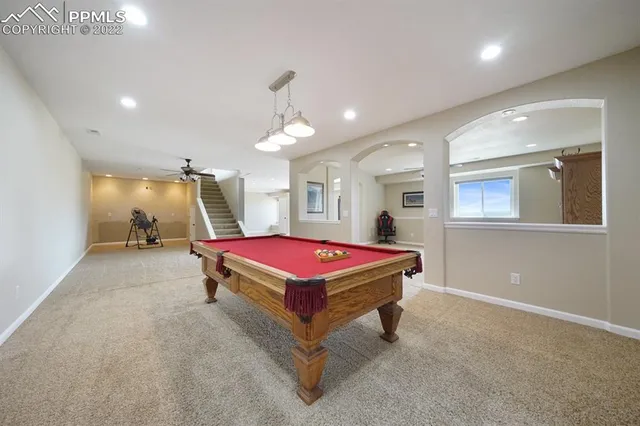 a view of a livingroom with furniture and a flat screen tv