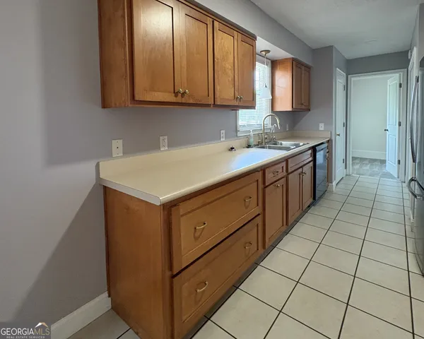 a kitchen with a sink and cabinets