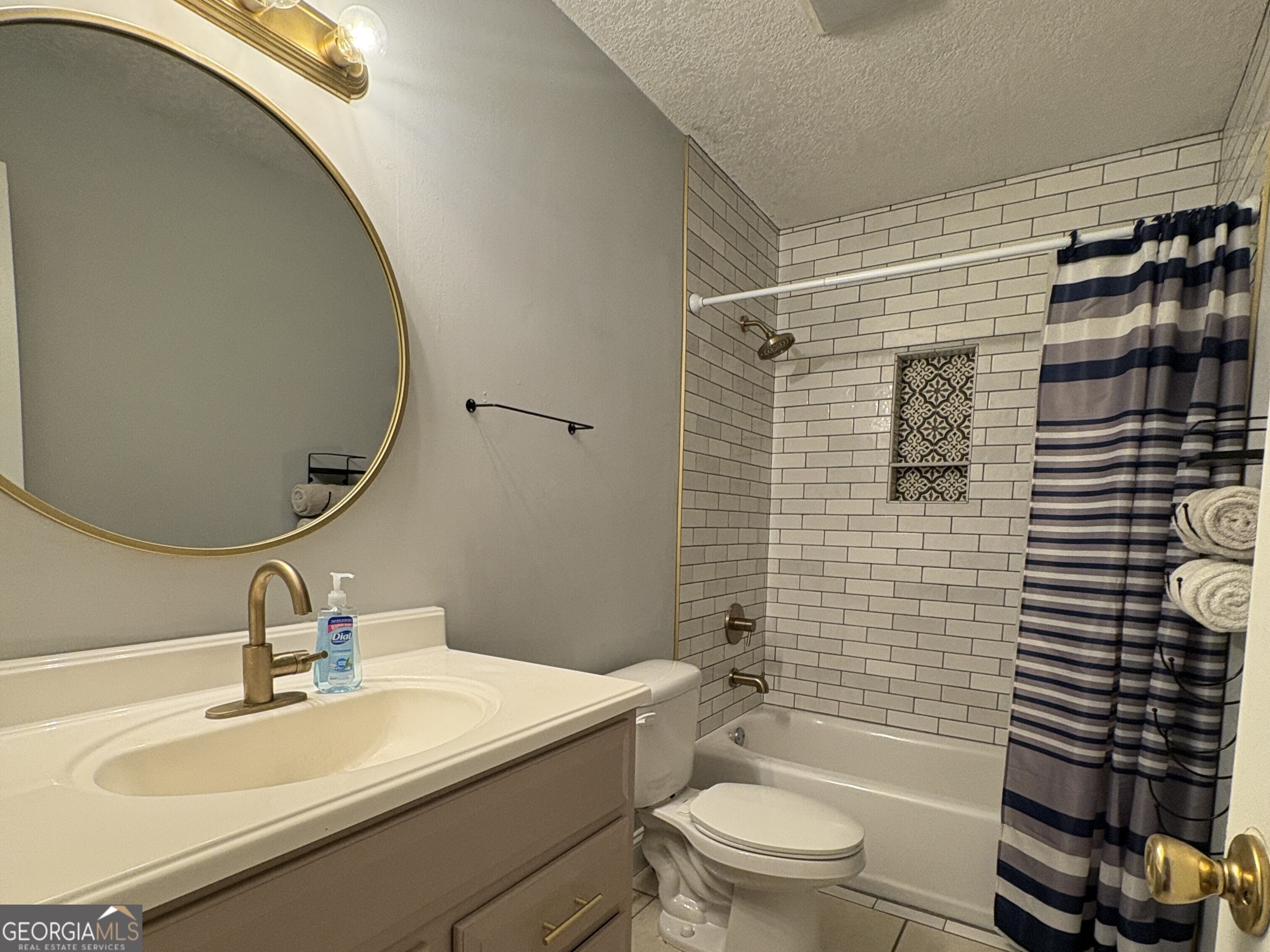 206 Palmetto Street St. Marys, GA 31558 - Photo 17 of 25 a bathroom with a sink toilet and shower