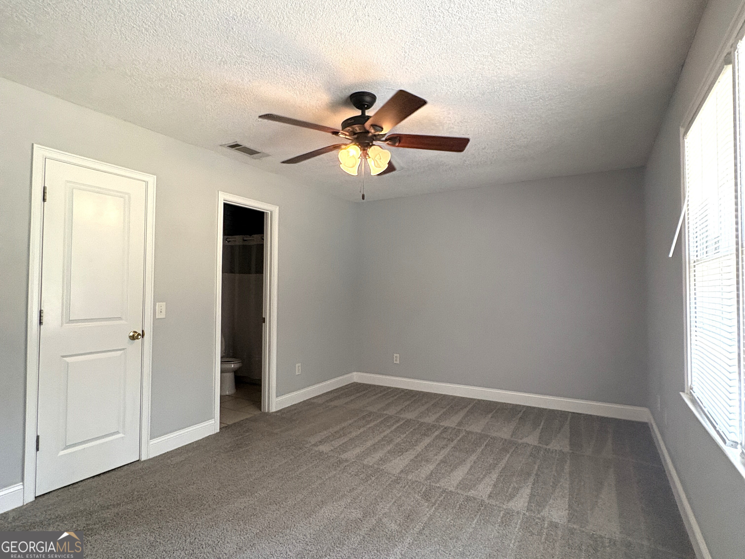 206 Palmetto Street St. Marys, GA 31558 - Photo 19 of 25 a view of room with window and ceiling fan