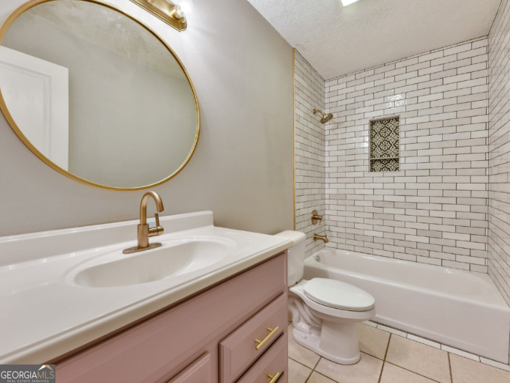 206 Palmetto Street St. Marys, GA 31558 - Photo 21 of 25 a bathroom with a sink a toilet and shower