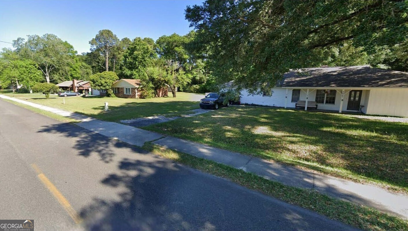 206 Palmetto Street St. Marys, GA 31558 - Photo 22 of 25 a view of a house with a yard