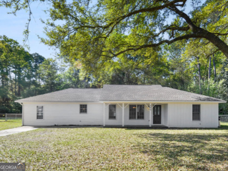 206 Palmetto Street St. Marys, GA 31558 - Photo 3 of 25 a backyard of a house with lots of green space