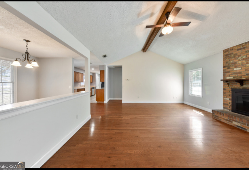 206 Palmetto Street St. Marys, GA 31558 - Photo 7 of 25 wooden floor in an empty room with a window