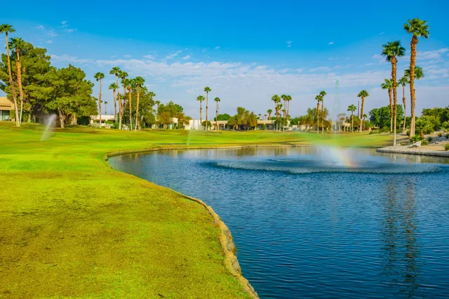a view of a swimming pool with an outdoor space and seating area
